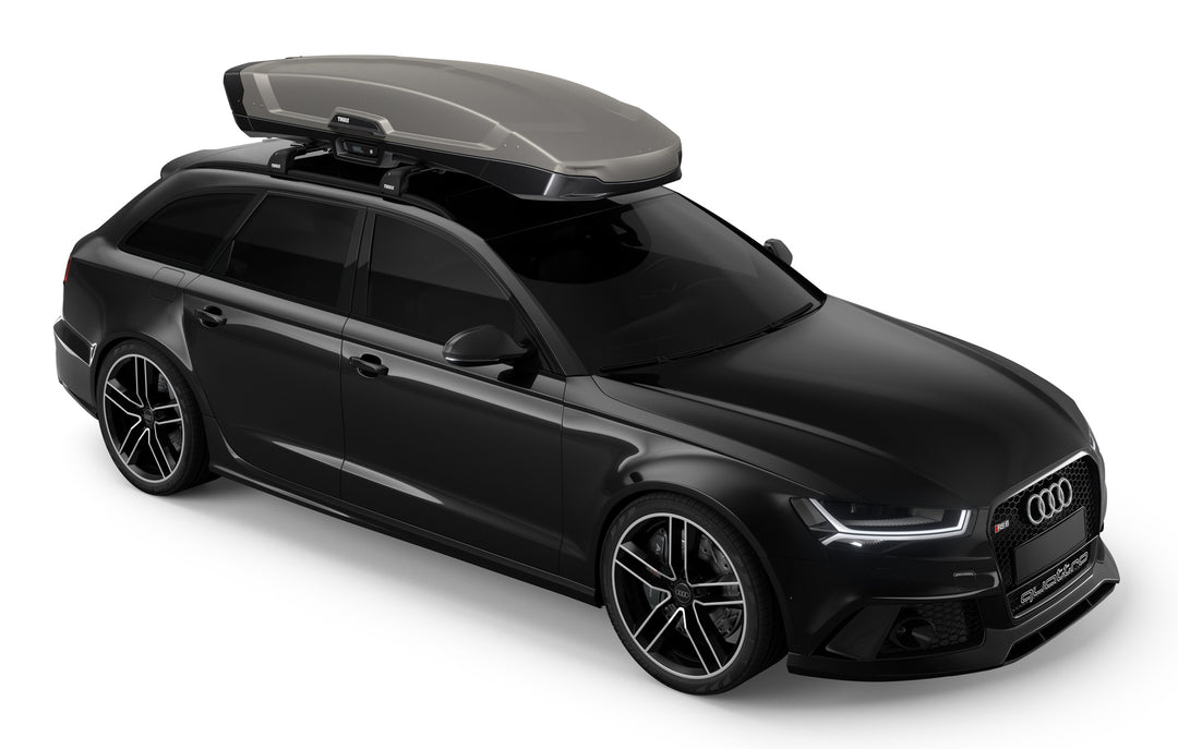 The Titan Matte Thulve Vector roof box on an Audi estate car for family holidays